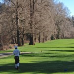 Martin follows through on shot on par 5 along Duwamish River - 21515